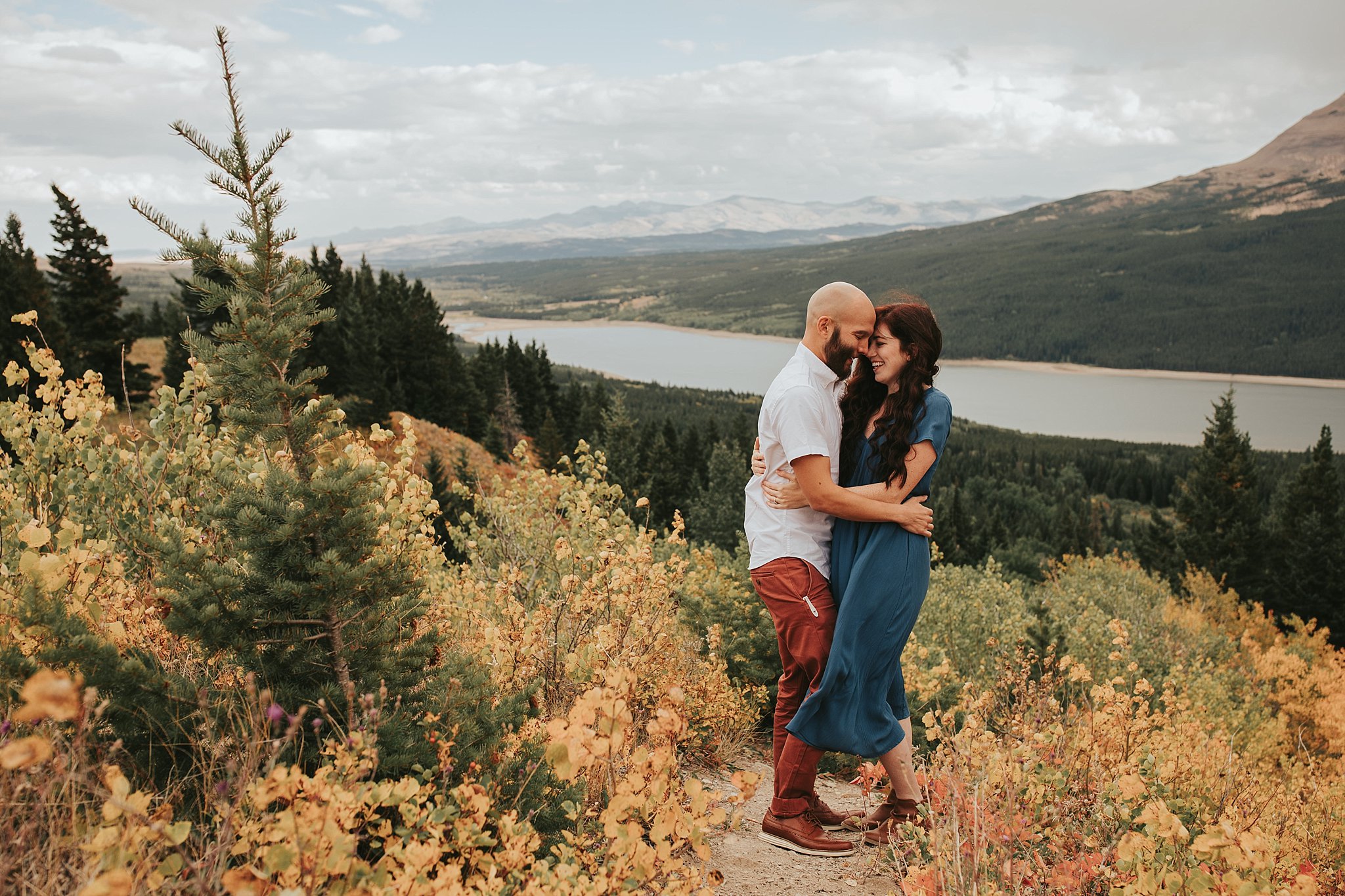 wind blowing fall engagement photos