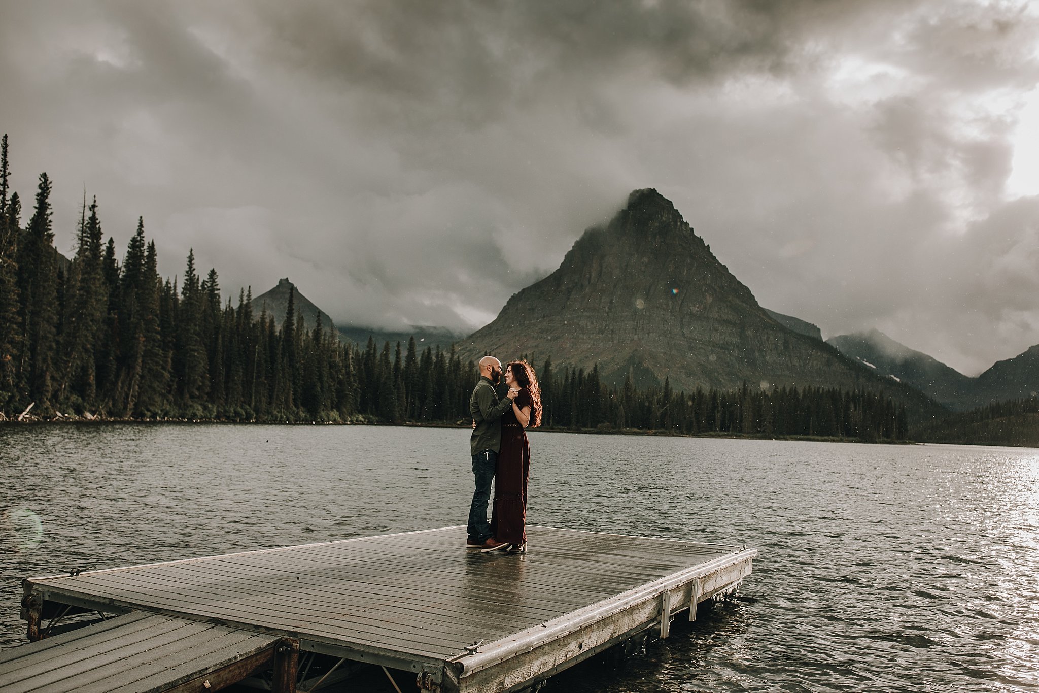 Couple Dancing in the rain on a dock
