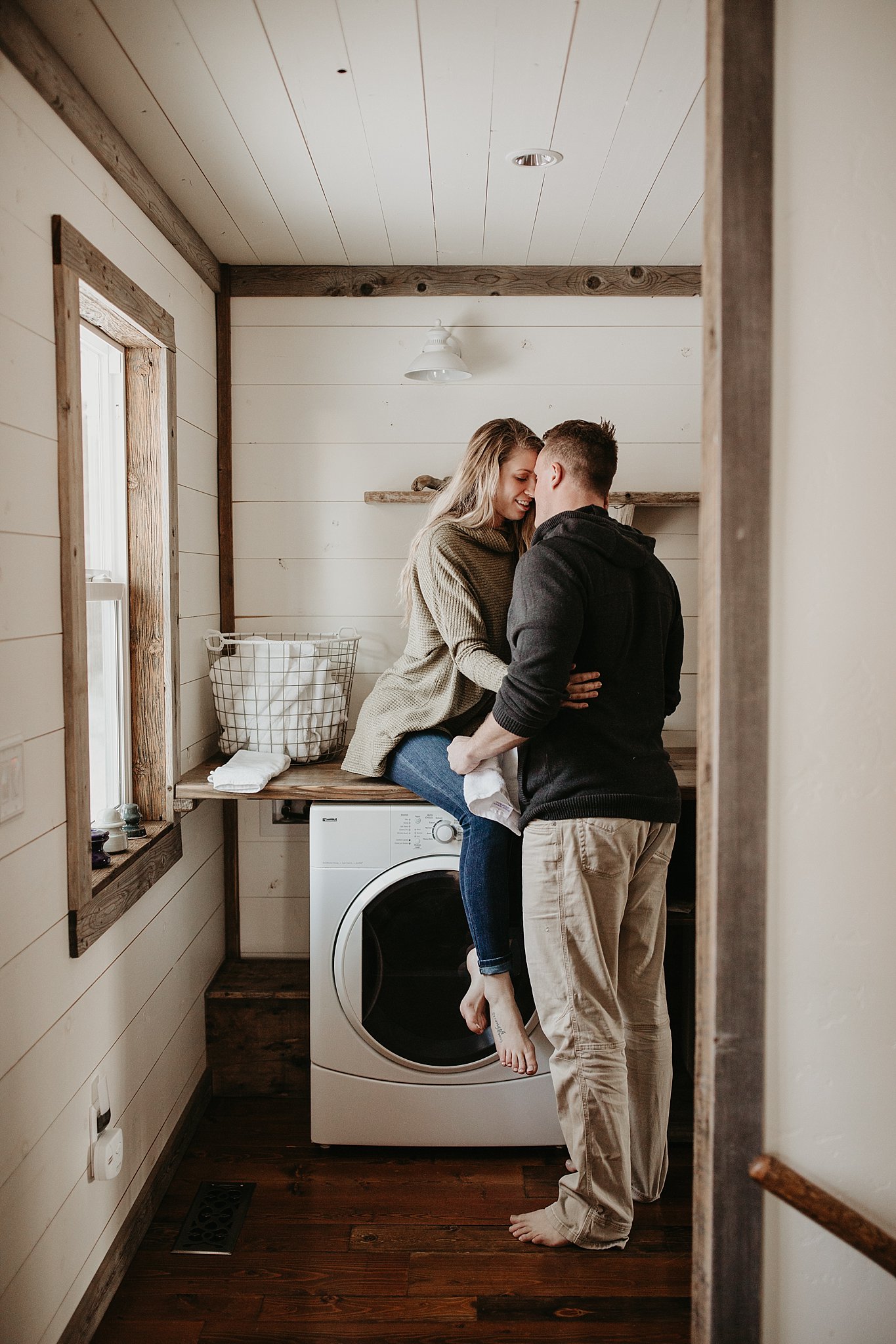Couple romantic photos by washer machine