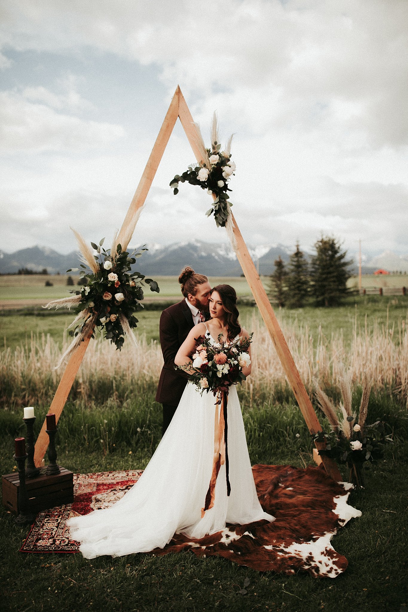 Bohemian elopement under triangle arch